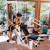 Home gym overlooking a garden with three large windows Home gym overlooking a garden with three large windows