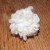 Roll the ball between your palms and you now have a cute, poofy pom pom. Roll the ball between your palms and you now have a cute, poofy pom pom.