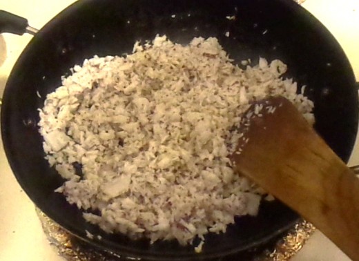 Put the grated coconut in the pan