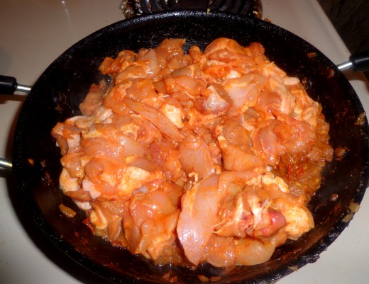 Put the marinated chicken inside the pan.