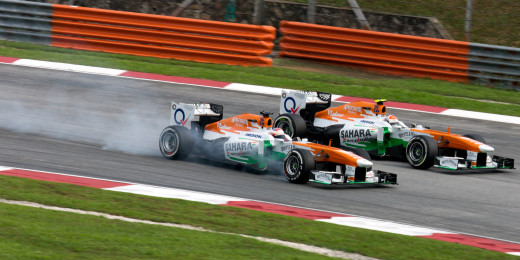 Paul di Resta overtaking Adrian Sutil at Malaysia in 2013.