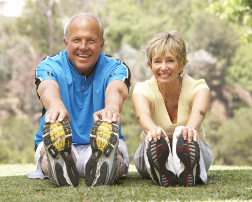 Health and Happy Male and Female Exercising