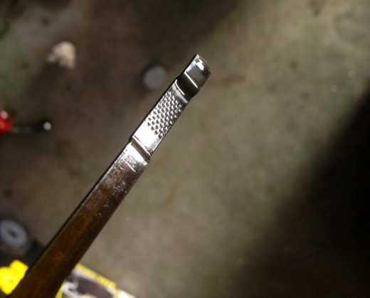 The dipstick just began to show oil around 4-quarts.  Its hashmarks are for the top/last quart in this engine.