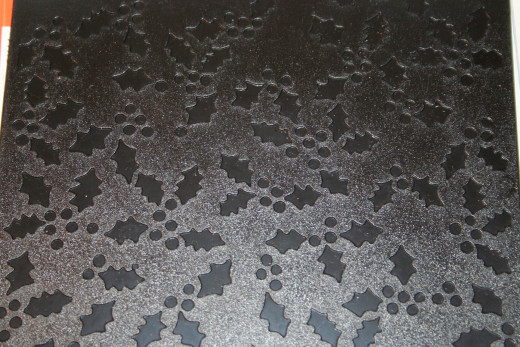 This is a holly berry Sizzix embossing folder.