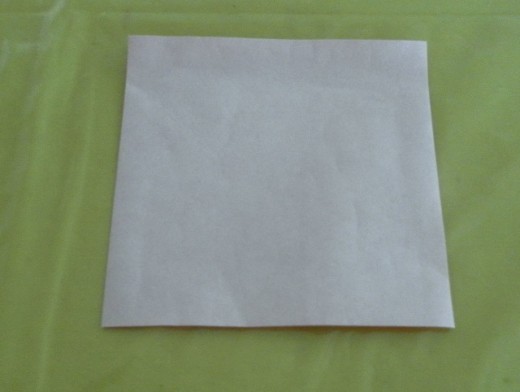 Turn the origami paper over. The other side of the paper should be white colour.