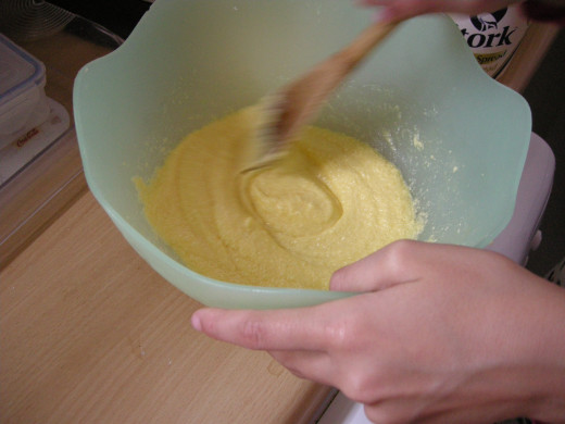 Add the egg yolk into the sugar and margarine mix