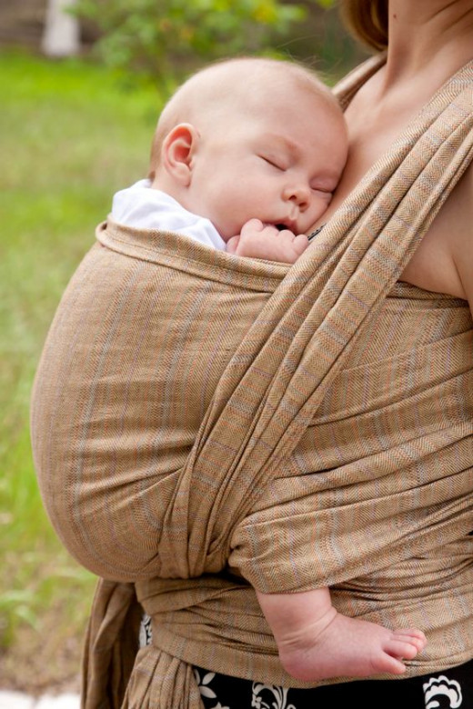 Many babies love sleeping cuddled up in a wrap sling.