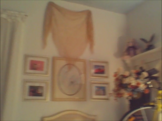 Bird print flanked by BB Bunny framed cards with ecru signature shawl draped above.