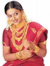 Bride bedecked in Gold Jewellery and Kanjeevaram Silk Saree