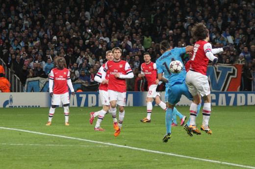 Arsenal FC vs. Olympique de Marseille Champions League match, 26 Nov 2013;  CC-BY-2.0, via Wikimedia Commons.