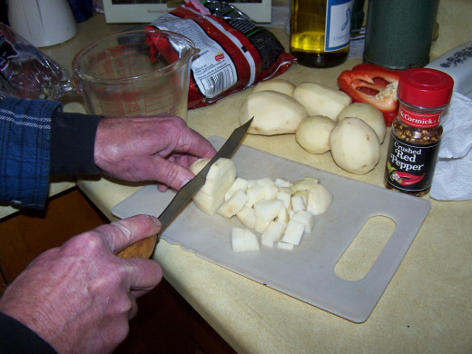 I dice the potatoes before I boil them, allowing them to soften faster.