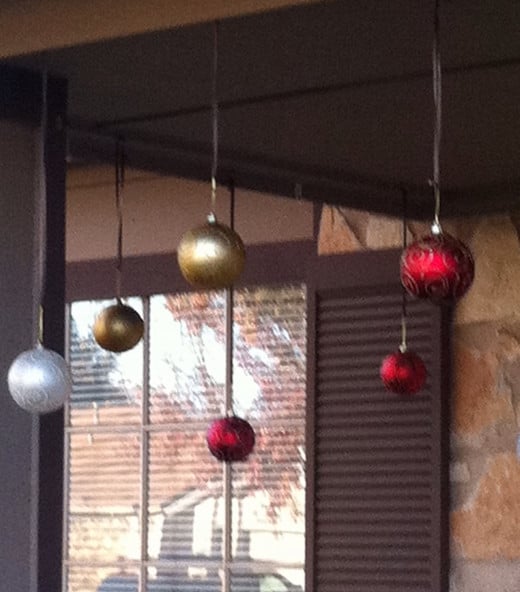 Hanging ornaments on the front porch