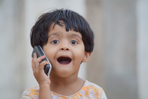 Happy child on a cellphone