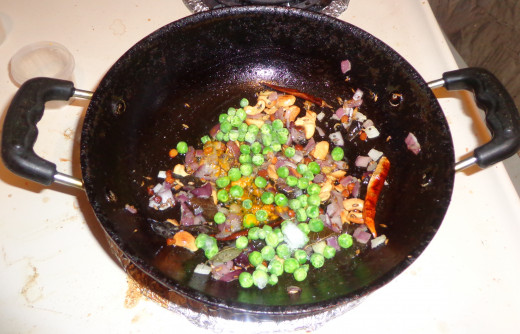 Peas, turmeric powder is added  