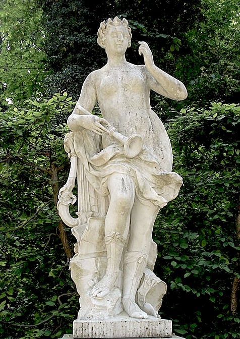 The Muse Erato--or possibly Euterpe, who is usually seen with an 'aulos', the instrument shown; Erato carries a lyre.  Either way, she is a musician.  Photo by Steffen Heilfort, courtesy Wikimedia Commons.