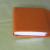 Wrap the cover over the pages and fold both ends of the paper inwards to make the front and back covers. Wrap the cover over the pages and fold both ends of the paper inwards to make the front and back covers.