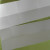 Using a cutter or a pair of scissors, starting from the first vertical crease line on the left, make a cut along the middle horizontal crease line all the way to the other end of the paper. Using a cutter or a pair of scissors, starting from the first vertical crease line on the left, make a cut along the middle horizontal crease line all the way to the other end of the paper.