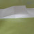 Start folding small squares from the other (right) end of the top flap of the paper, using the vertical crease lines as guides. Start folding small squares from the other (right) end of the top flap of the paper, using the vertical crease lines as guides.
