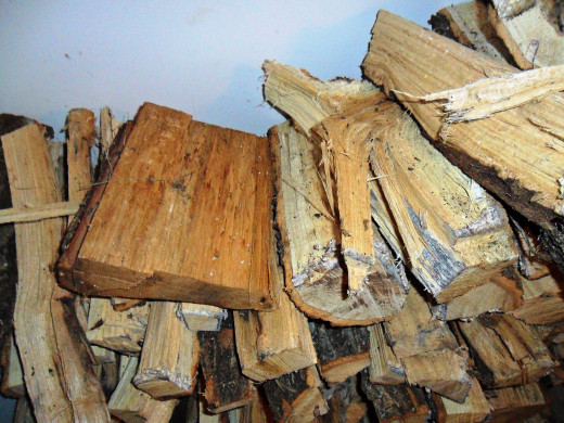 You can see a big difference in color between the seasoned wood (left) and the green or newly cut log (right)
