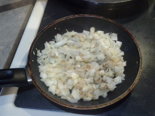 Step Two: Cook your chopped onions and garlic in a saute pan until translucent