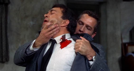Prof. Michael Armstrong (Paul Newman) kills Hermann Gromek (Wolfgang Kieling) in Torn Curtain.