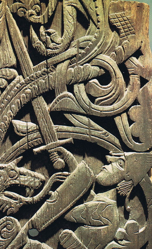 Fighting Jormungand, the serpent winds itself around the framework of the carving