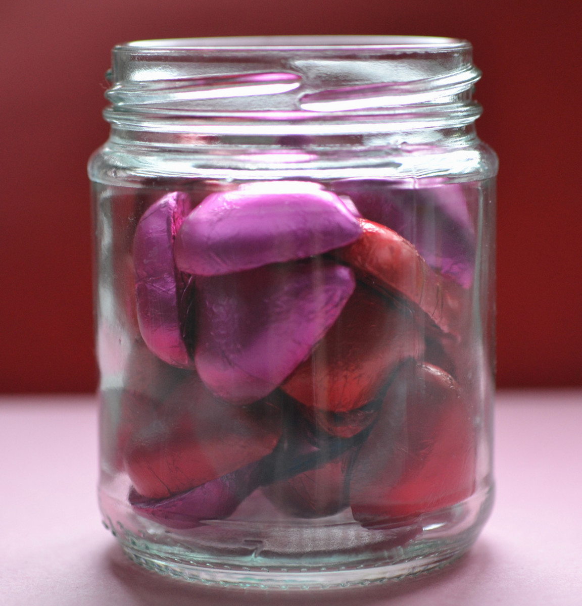 Most any candies will work well for jarred candies. Make sure to purchase something that will fit nicely into your jar. For example, you may wish to use wrapped, heart-shaped chocolates or conversation hearts. Red hots work too!