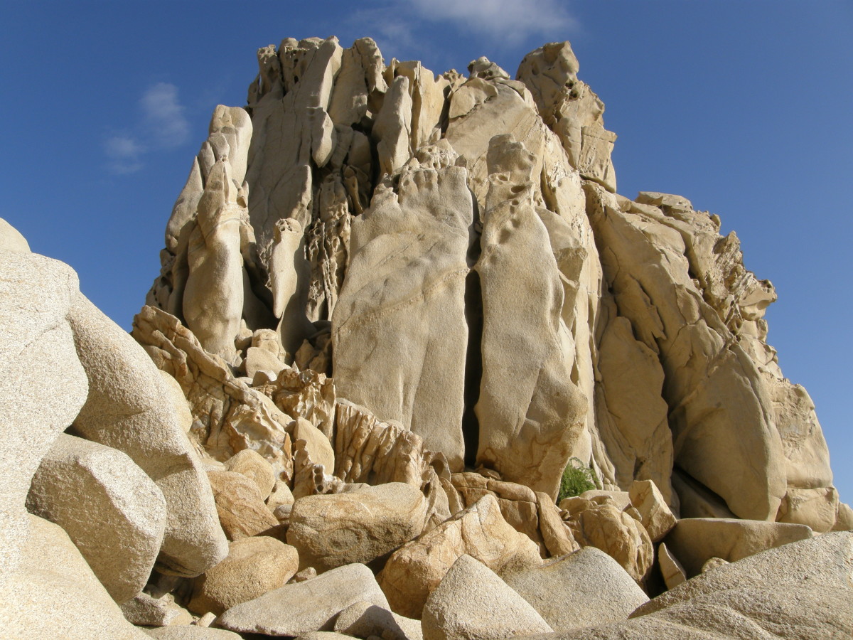 The rock is made of limestone and granite.  While they are fun to climb, they can be very dangerous.