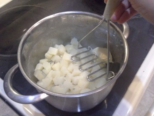 Step Twenty-six: Mix well with your potato smasher