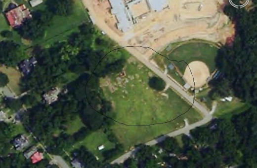 We have the main part of the old cemetery circled there but you can see old graves in front of the baseball diamond at the new school there.
