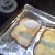 Step Four: With a large spoon, shake a thick layer of sugar onto each piece