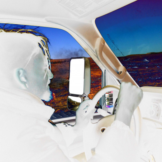 A candid photo taken  of me behind the wheel.