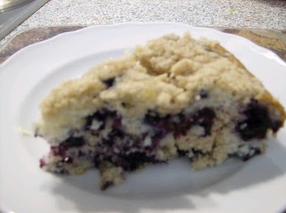Slice of gluten free wild blueberry coffee cake.