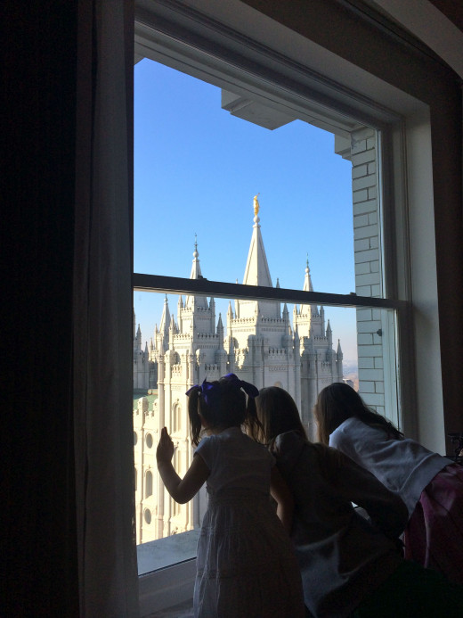 Some of our grandchildren looking out of the window of the Joseph Smith Memorial Building towards the Salt Lake City Temple.