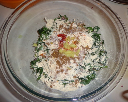 Ingredients to prepare kofta is added inside the bowl with spinach.
