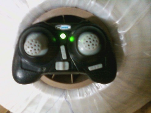 Mini quadcopter with remote control unit.