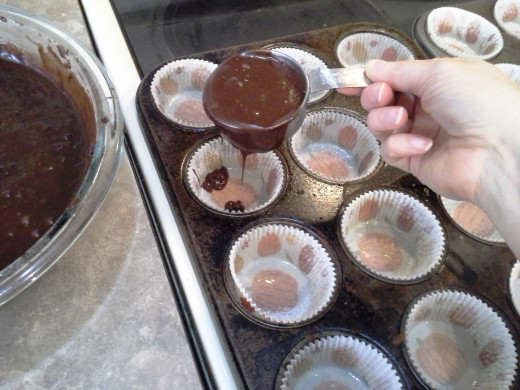 Step Twenty: Fill each of your cupcake liners half full with chocolate cake batter