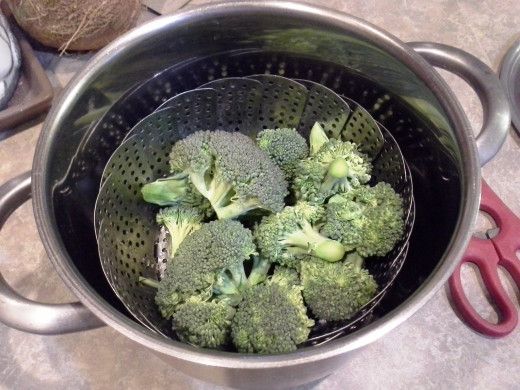 Step Three: Break up an entire head of broccoli into smaller chunks and place them in your steamer basket.