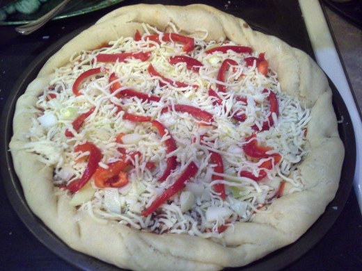 Step Nineteen: If you add any additional toppings, finish with another thin layer of cheese
