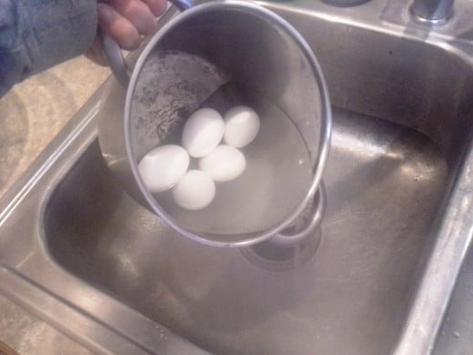 Step Nine: As soon as your eggs are done, drain them in the sink