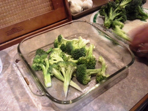Step Four: Start laying out your broccoli pieces in the bottom of your casserole dish