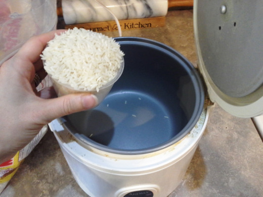 Step One: Start by adding your rice to your rice cooker