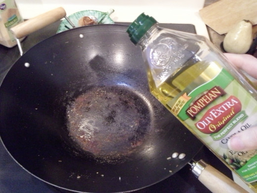 Step Twenty-three: Now to cook your veggies; Add a small amount of olive oil to your hot Wok