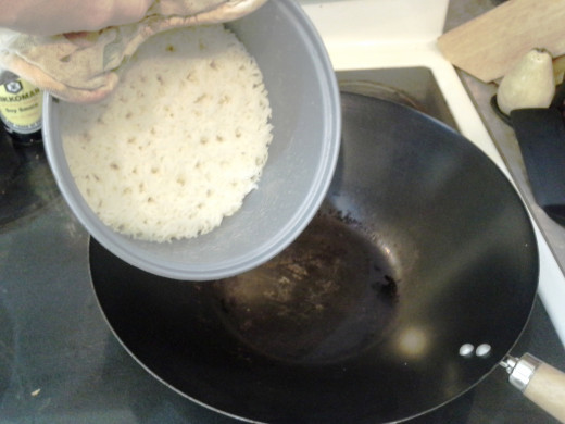 Step Five: When your rice is finished, dump it in your Wok