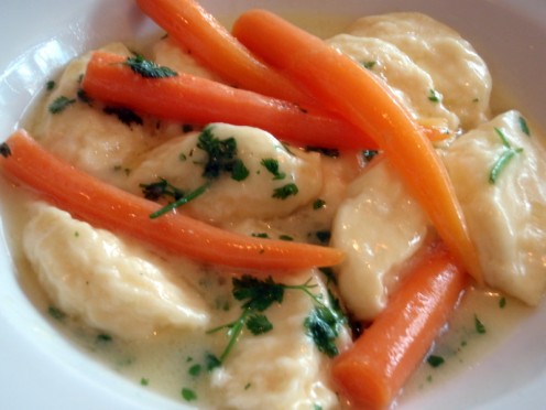 Baby Carrots that are longer that were grown in a pot and used in a culinary dish. To be served to friends or family.