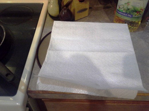 Step Fifteen: Prepare a plate with a paper towel on the side for drying after frying
