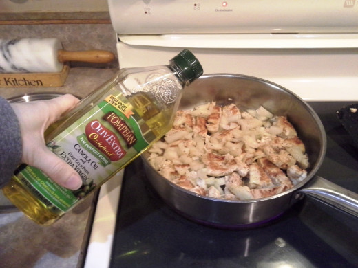 Step Fourteen: Add a bit of oil to help the onions cook