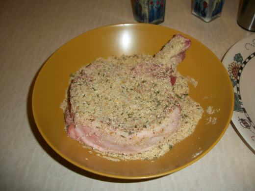 Cover completely with seasoned in bread crumbs and spray both sides with olive oil spray.