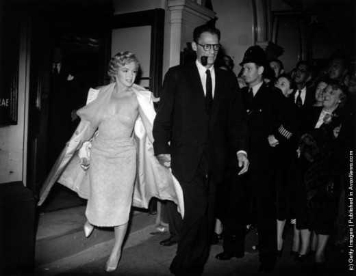 Marilyn, looking lovely in a calf-length dress and matching coat.