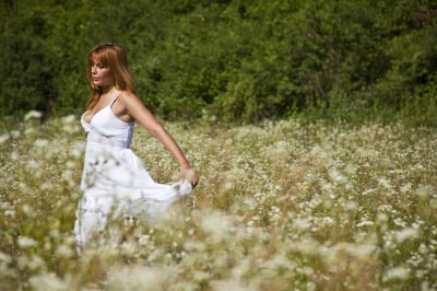 Young Woman in Meadow Stock Photo by adamr ID:10091215